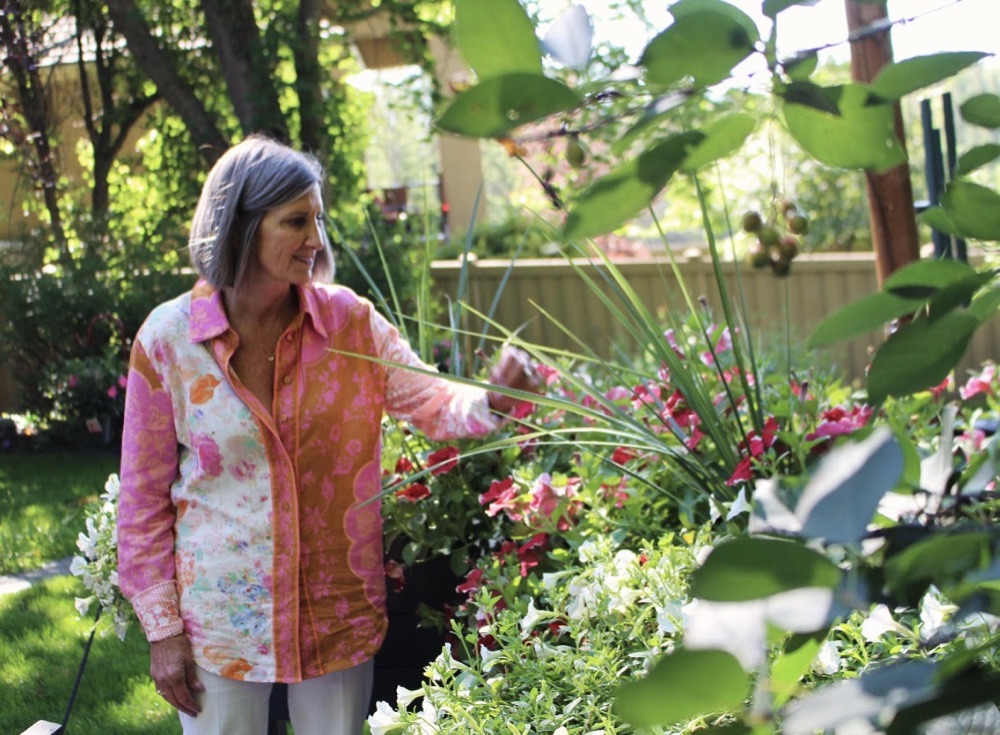 Karen Peters walking through her garden