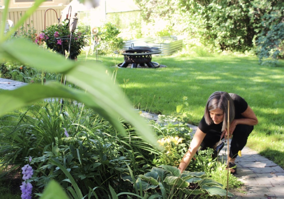 Karen Peters working in her garden